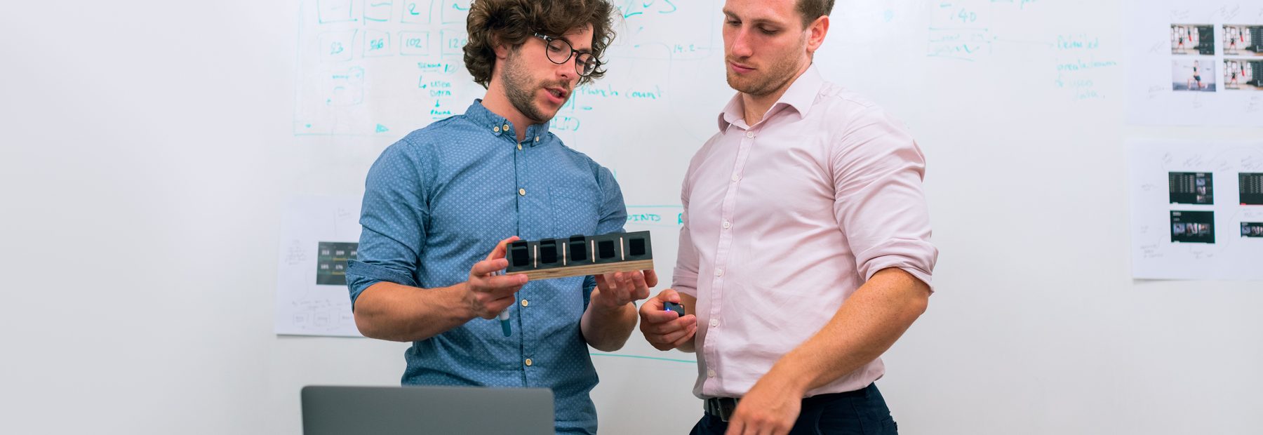 ASME engineers reviewing a hardware module together
