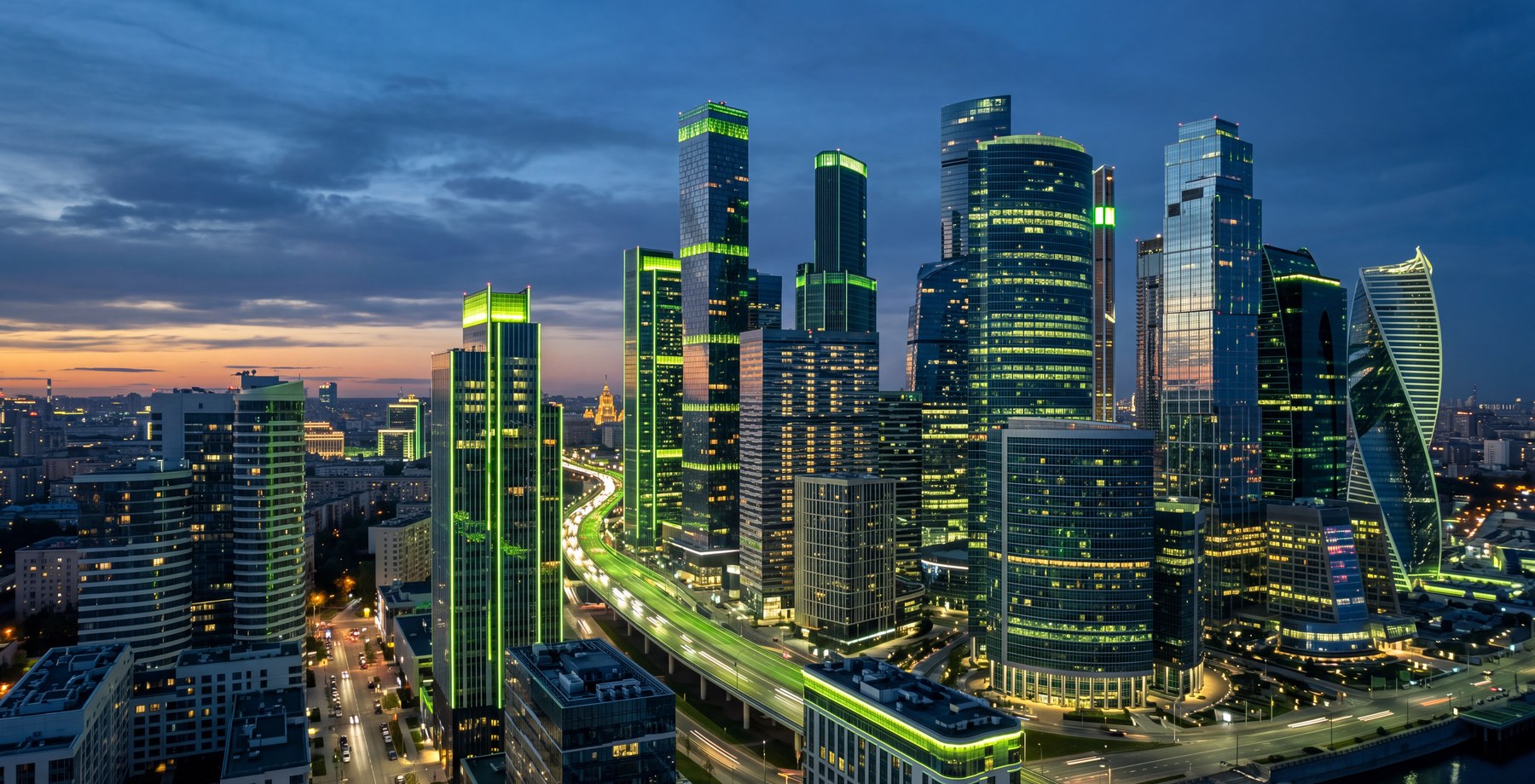 Modern high-rise skyline lit at dusk